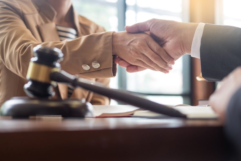 A DWI attorney and client shaking hands