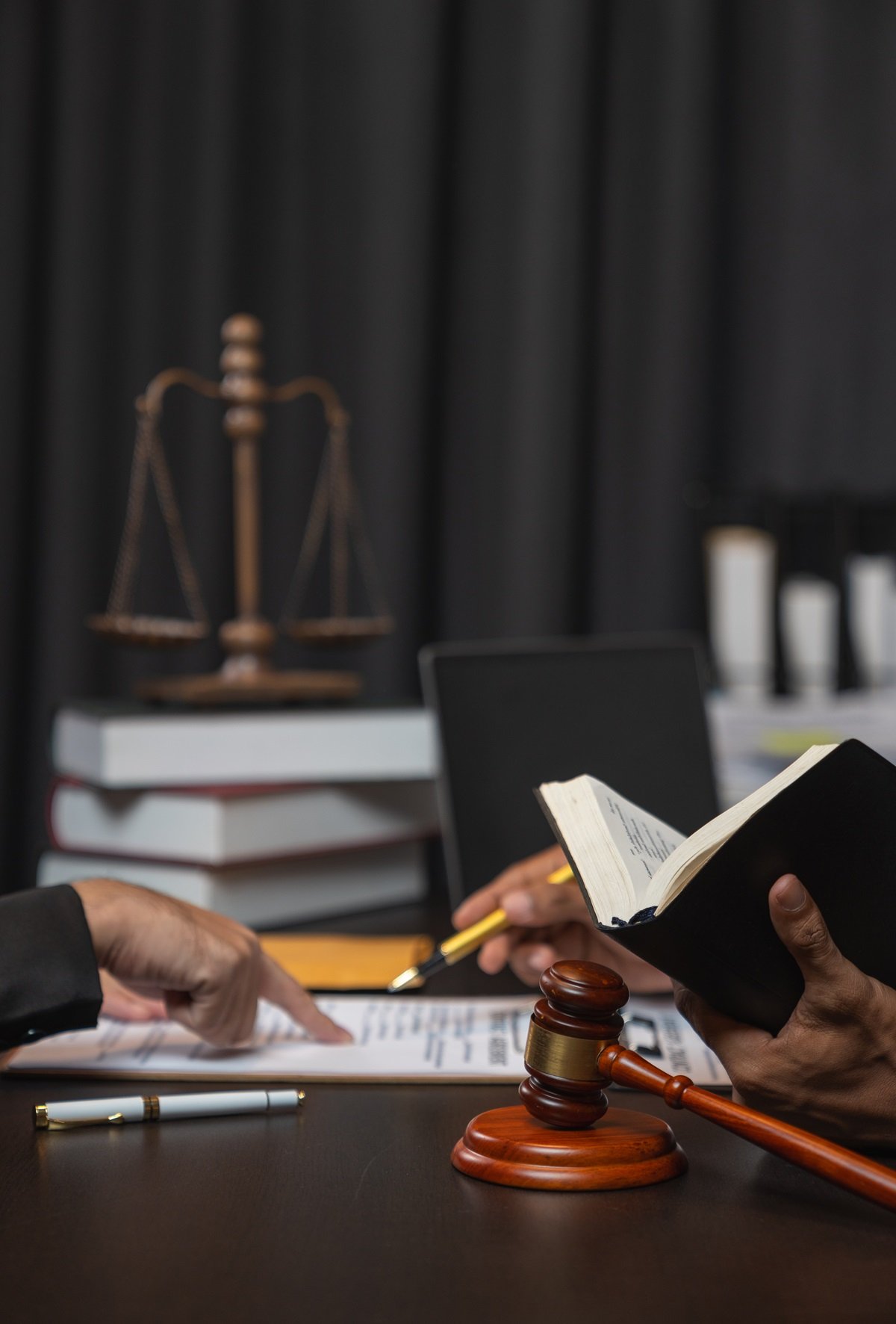 
A lawyer conferring with a judge at trial