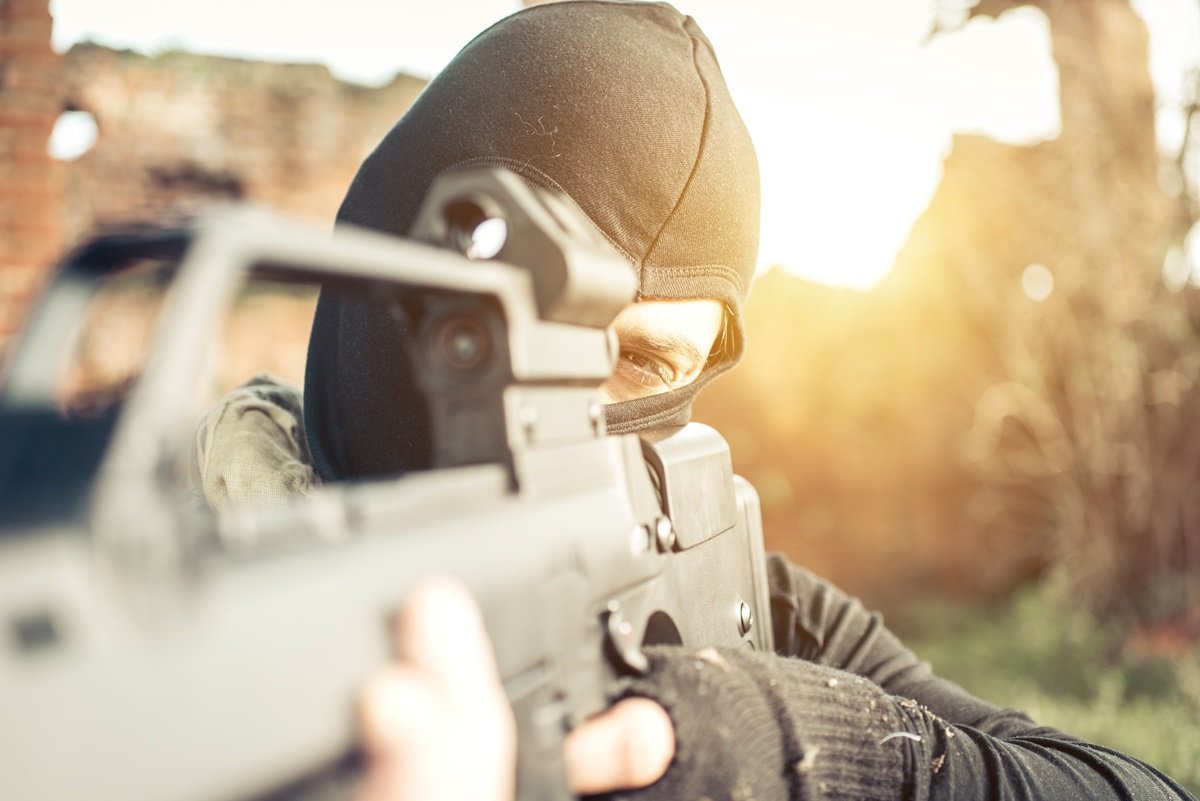 An armed masked man