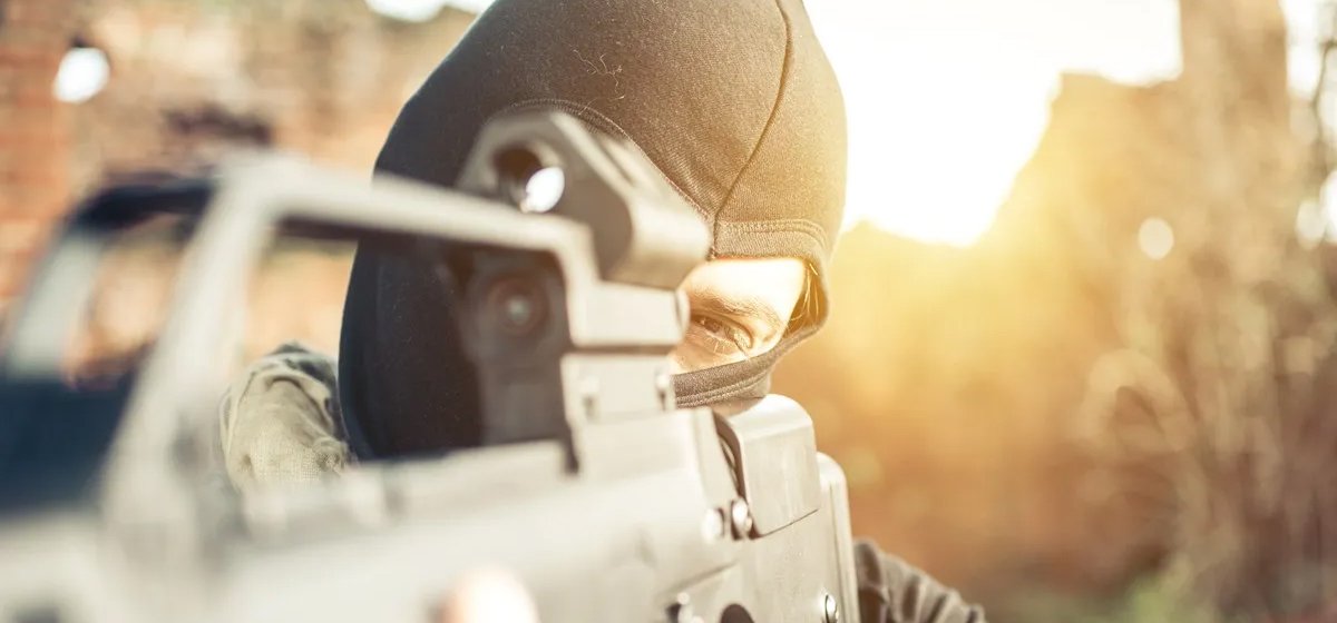 An armed masked man