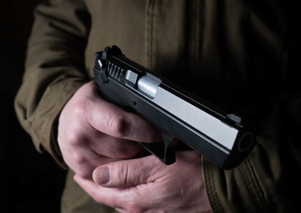 A man holding a handgun