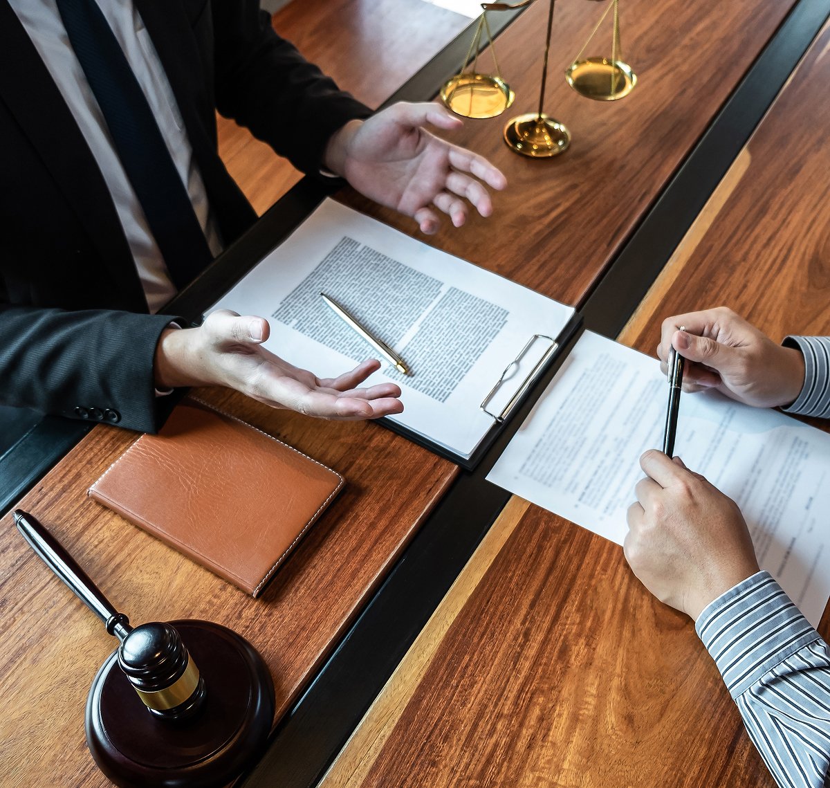 A client sitting across from a lawyer