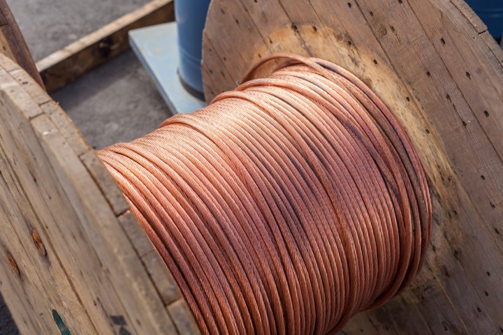 Industrial copper wire rolled around wood