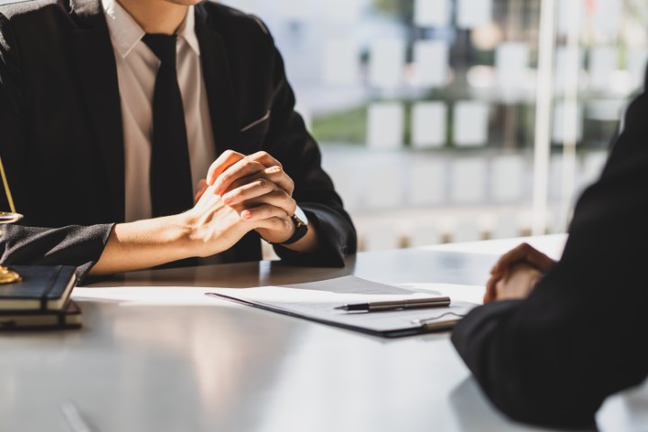 A legal professional in a counseling session with a client