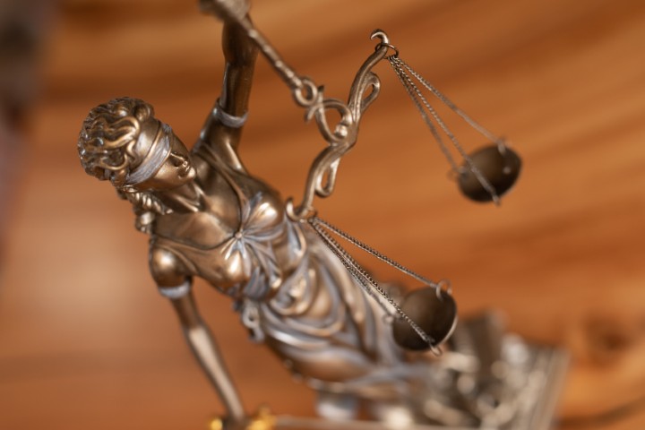 A close up shot of a Lady Justice statue