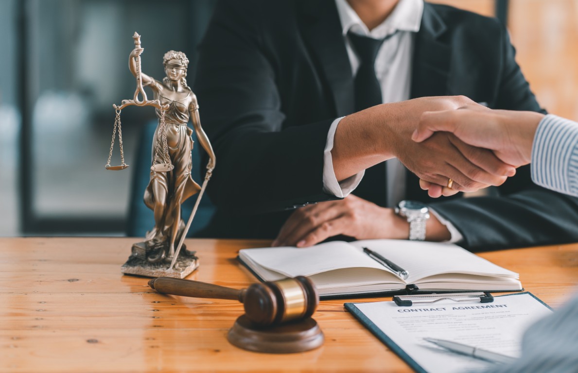 A lawyer shaking hands with a client