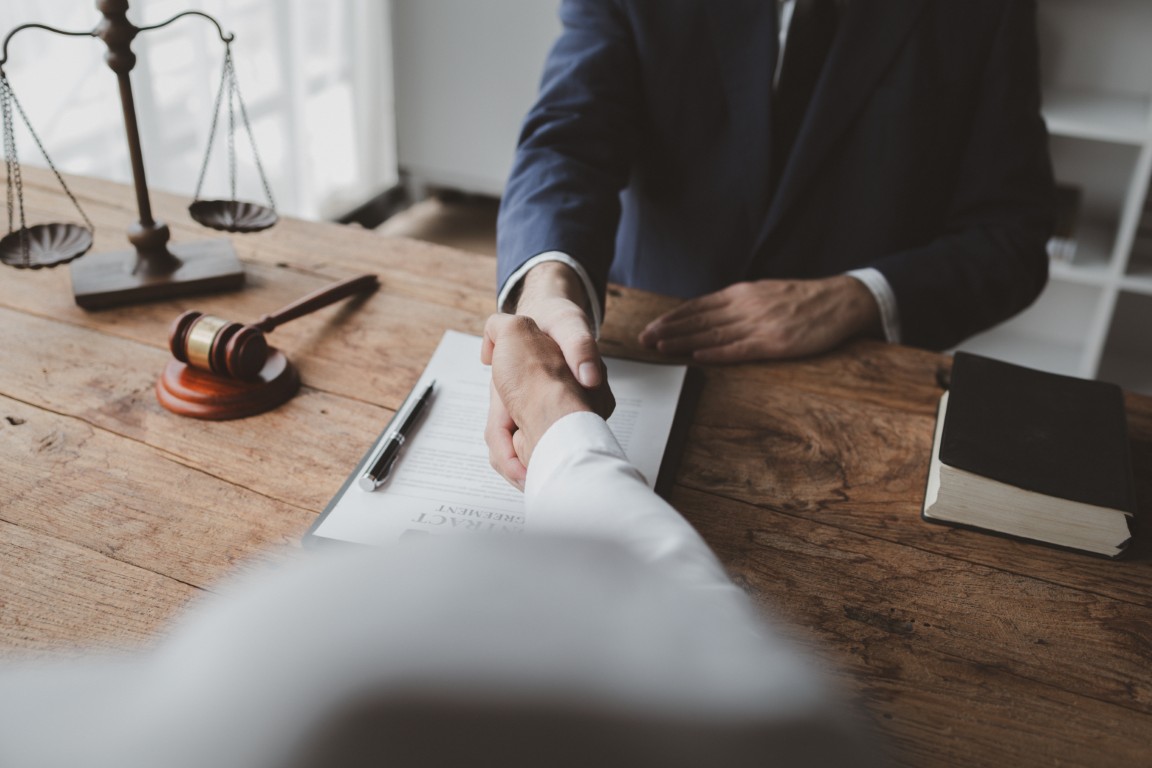 A client shaking hands with a lawyer